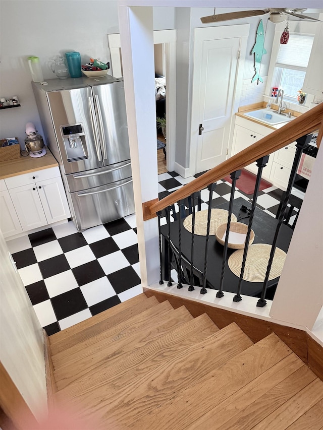 staircase featuring tile patterned floors