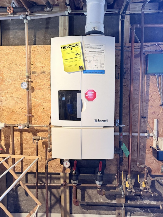 utility room with water heater