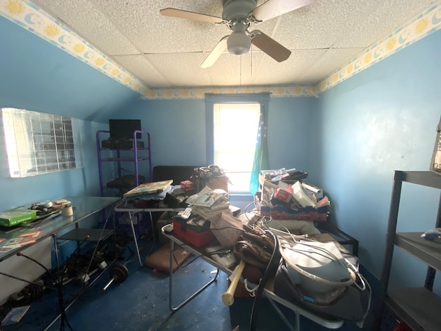 interior space featuring ceiling fan and lofted ceiling