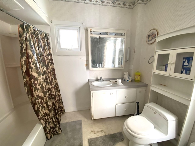 full bathroom featuring shower / tub combo with curtain, toilet, and vanity