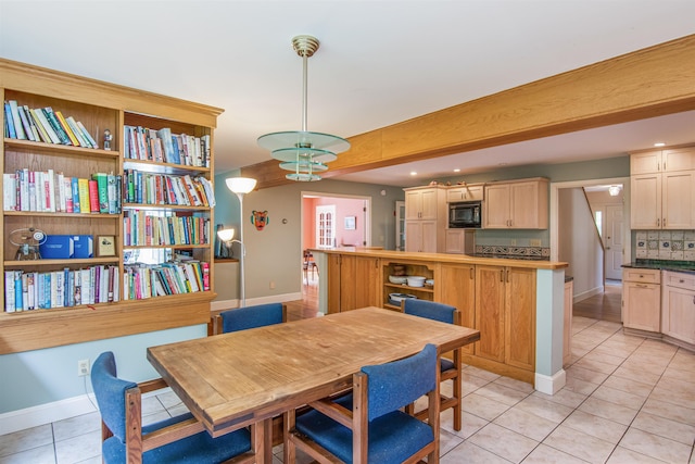 dining space with light tile patterned floors, recessed lighting, and baseboards