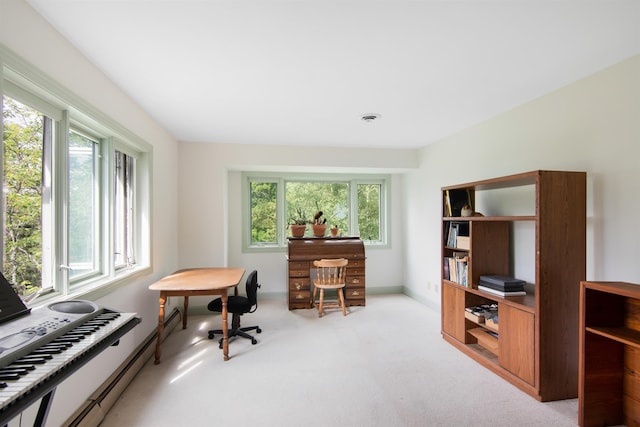 office space with baseboards and light colored carpet