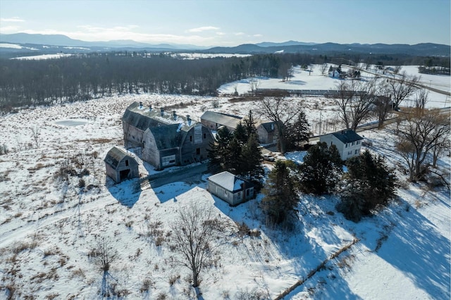 snowy aerial view featuring a mountain view