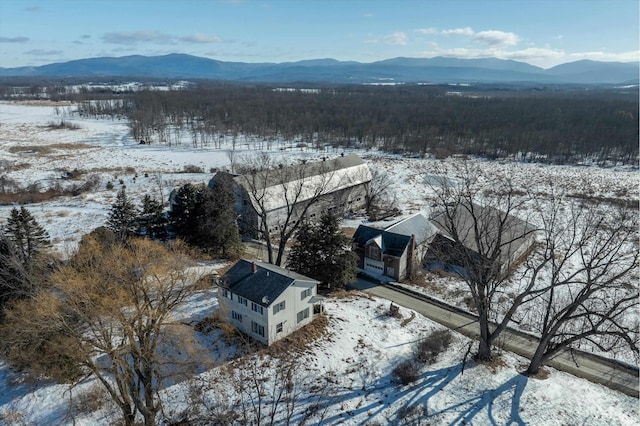 snowy aerial view with a mountain view