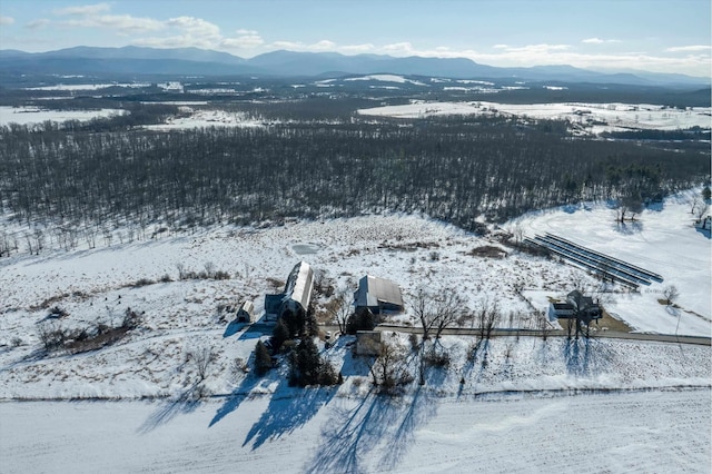 snowy aerial view featuring a mountain view