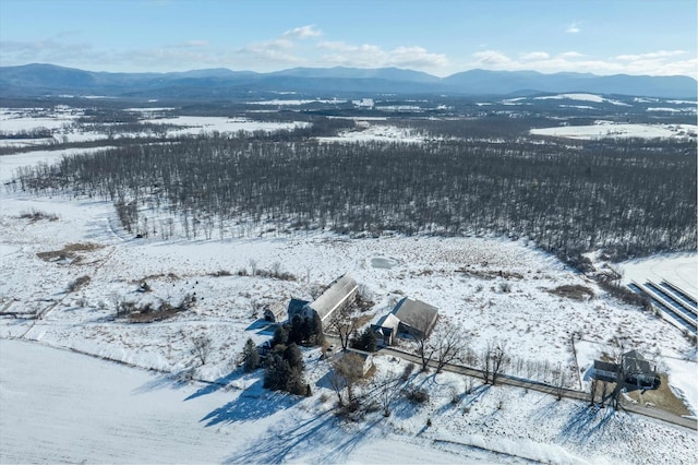 snowy aerial view featuring a mountain view