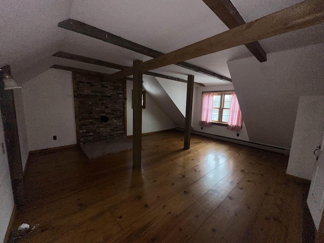 bonus room with lofted ceiling with beams and hardwood / wood-style flooring