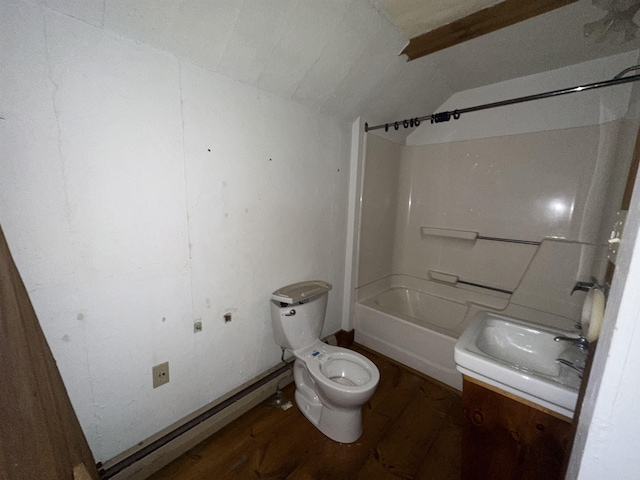 bathroom featuring toilet, wood finished floors, lofted ceiling, bathing tub / shower combination, and vanity