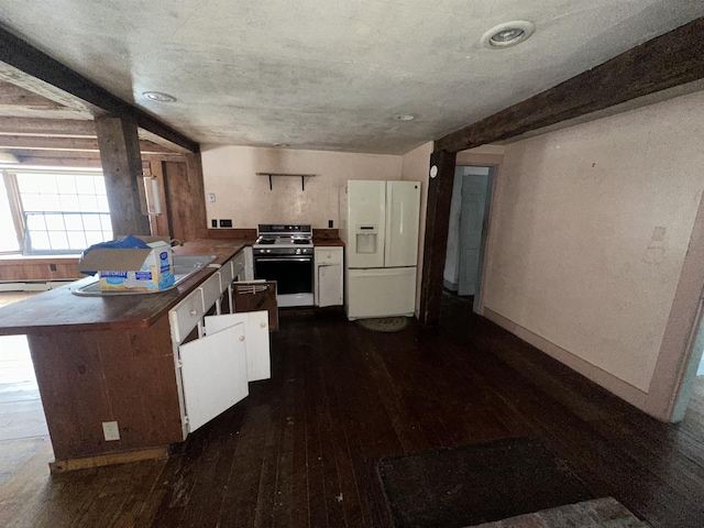 kitchen with dark countertops, range with electric stovetop, dark wood-style floors, white fridge with ice dispenser, and a peninsula