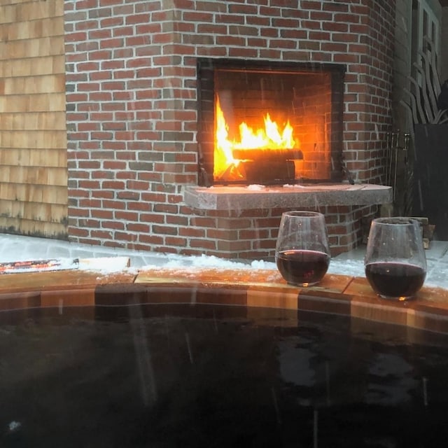 room details featuring a lit fireplace