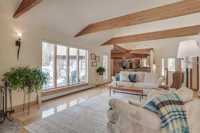 living area featuring vaulted ceiling with beams, wood finished floors, plenty of natural light, and baseboard heating