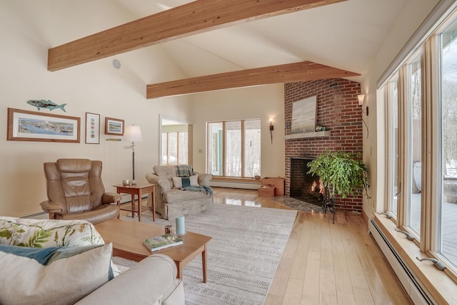 living room featuring beam ceiling, baseboard heating, light wood-style flooring, a fireplace, and high vaulted ceiling