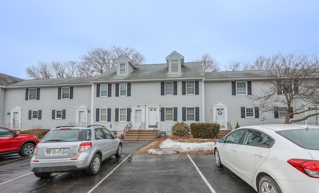 view of property featuring uncovered parking