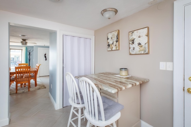 dining room with baseboards