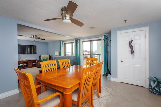 dining room featuring visible vents and baseboards