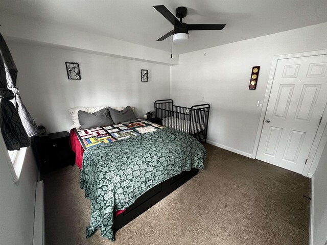 carpeted bedroom featuring a ceiling fan and baseboards