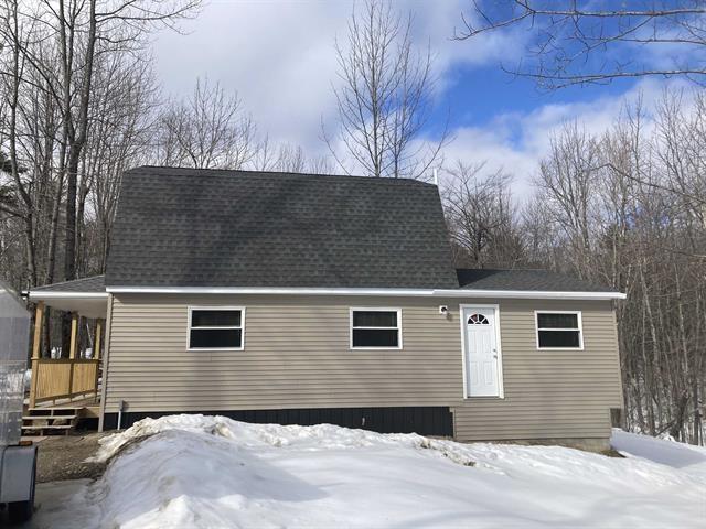 view of front of house with a shingled roof