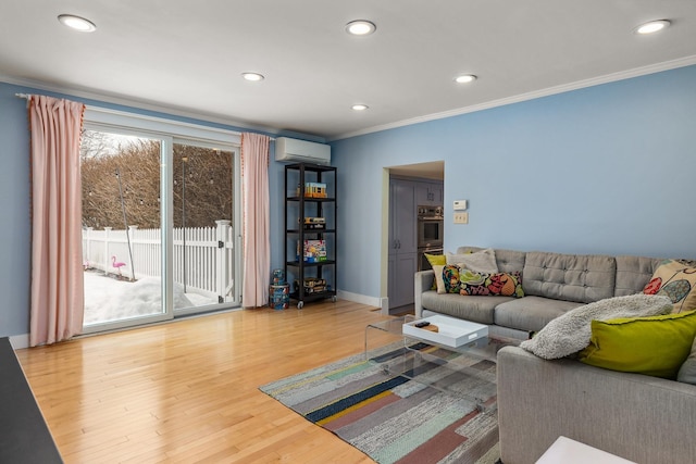 living room featuring a wall mounted air conditioner, wood finished floors, ornamental molding, and recessed lighting