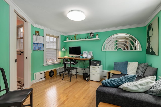 office with ornamental molding, a baseboard radiator, and wood finished floors