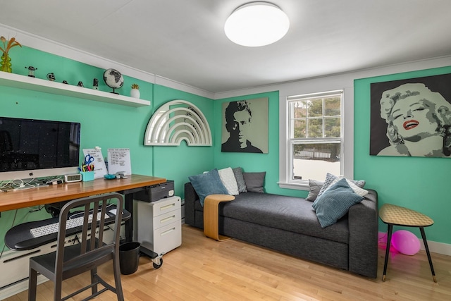 office featuring ornamental molding and wood finished floors