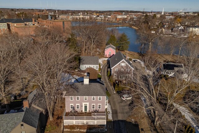 drone / aerial view with a water view and a residential view