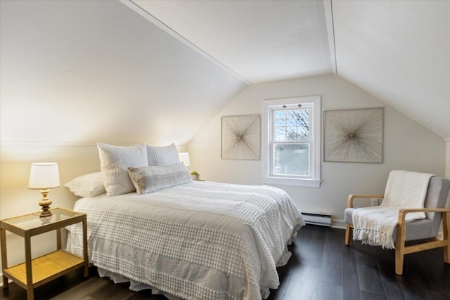 bedroom with a baseboard radiator, lofted ceiling, and wood finished floors