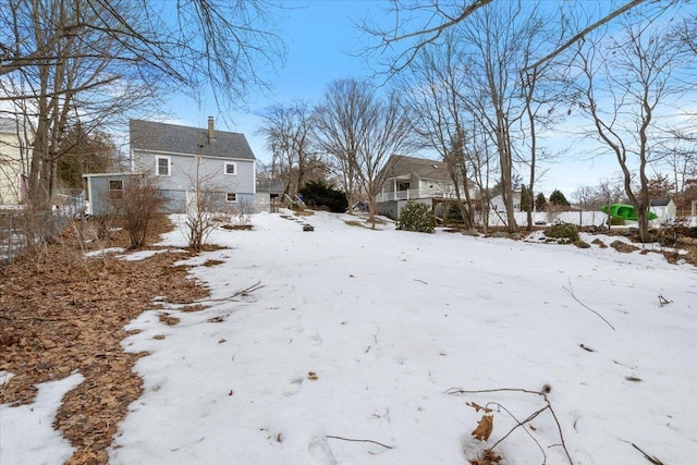 view of yard covered in snow