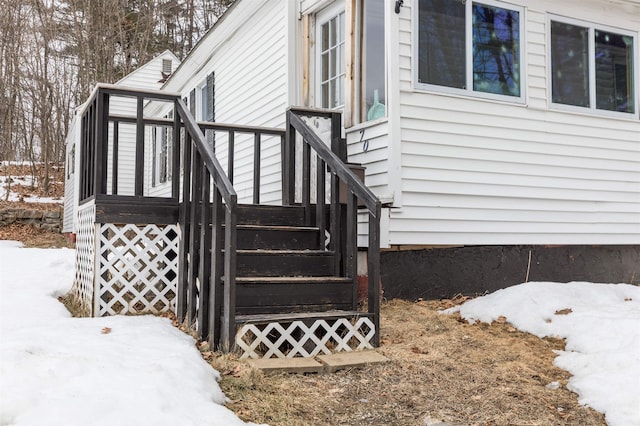 view of snow covered property entrance