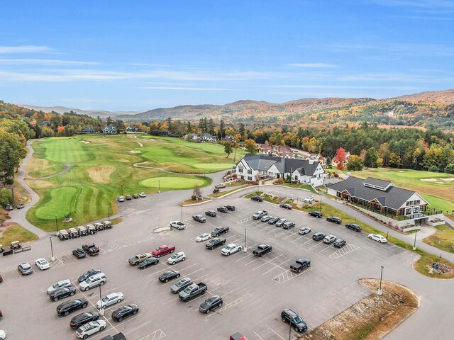 bird's eye view with a mountain view and golf course view