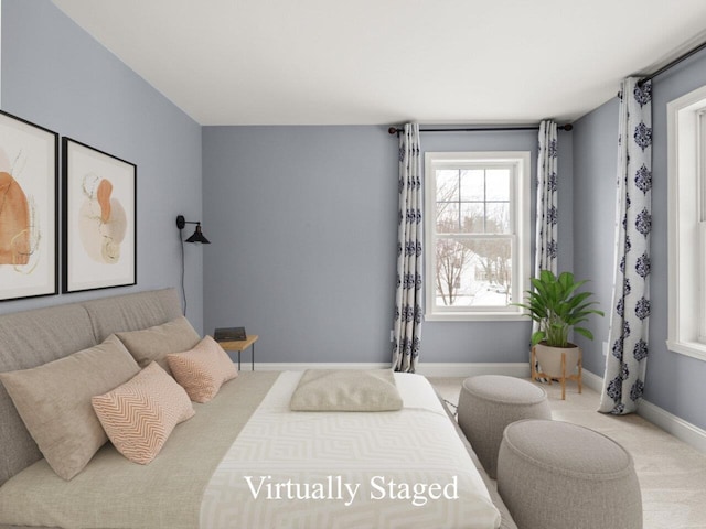 bedroom featuring baseboards and carpet floors