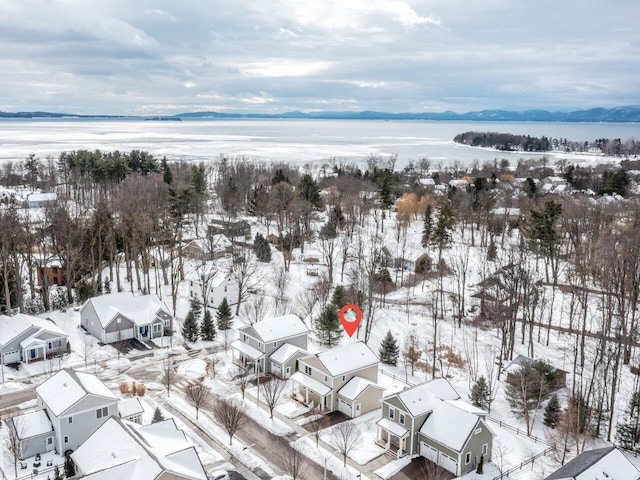 snowy aerial view featuring a residential view