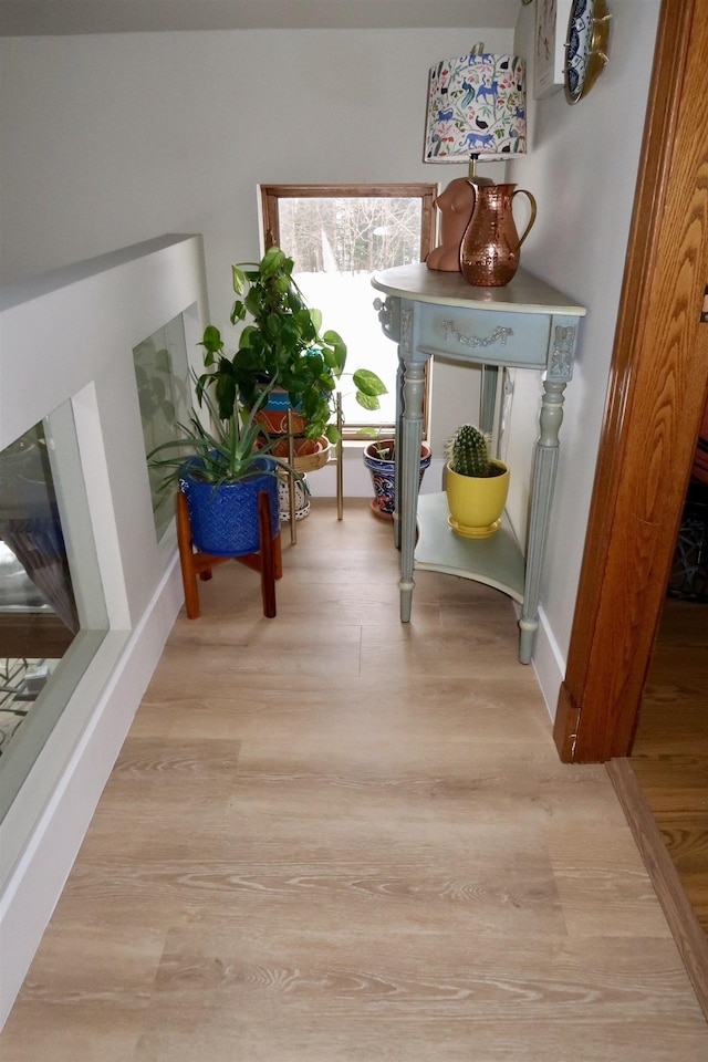 sitting room featuring light wood-style flooring and baseboards