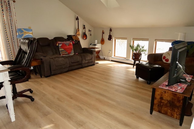 living area with a baseboard heating unit, light wood-type flooring, and vaulted ceiling