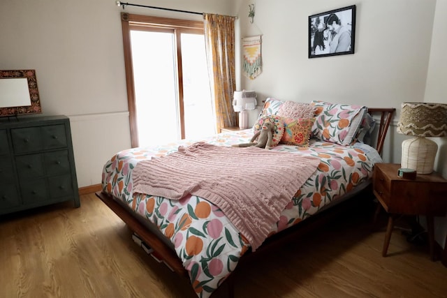 bedroom featuring wood finished floors