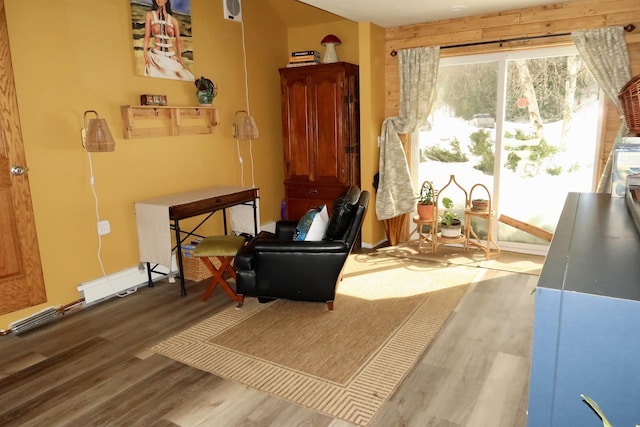 living area featuring wood finished floors and baseboards