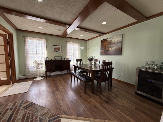 dining area with a baseboard heating unit, beam ceiling, coffered ceiling, a textured ceiling, and wood-type flooring