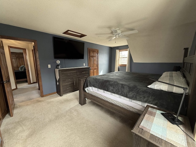 bedroom with baseboards, light carpet, a textured ceiling, and ceiling fan