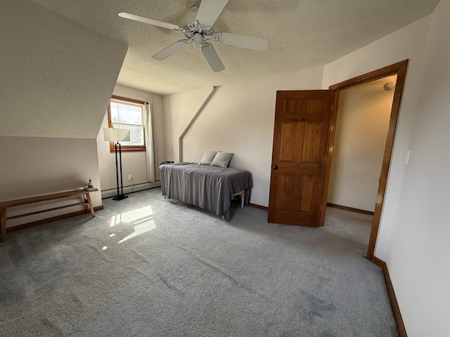 bedroom featuring lofted ceiling, carpet flooring, baseboards, and a textured ceiling