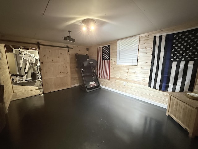 interior space featuring a barn door, wood walls, and radiator heating unit