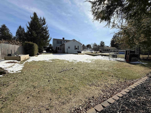 view of yard featuring a garden and fence