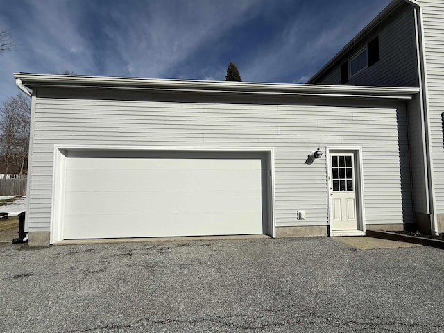 garage featuring driveway