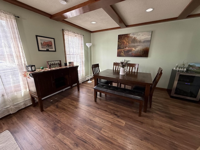 dining room with beamed ceiling, coffered ceiling, a textured ceiling, and wood finished floors