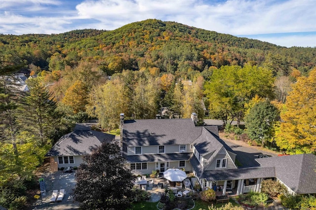 birds eye view of property with a wooded view