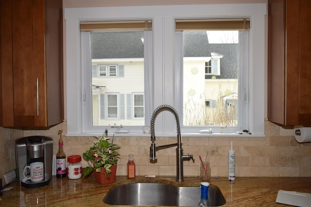 kitchen featuring a sink and tasteful backsplash