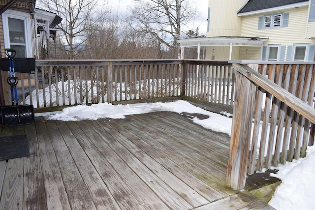 view of snow covered deck