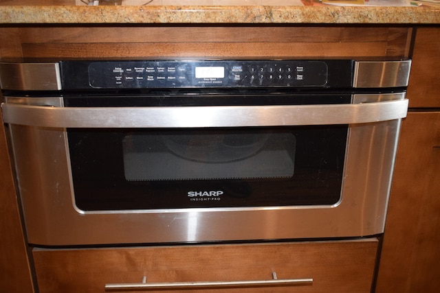 interior details with stainless steel oven