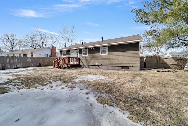 rear view of property with fence