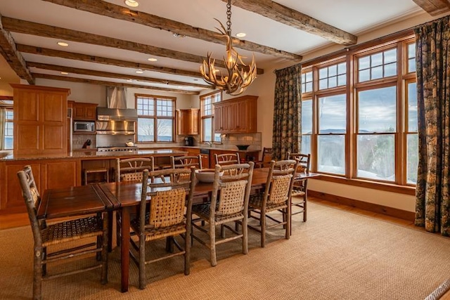 dining room with beam ceiling, a notable chandelier, recessed lighting, and baseboards