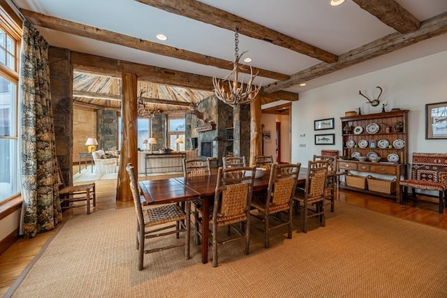 dining room with recessed lighting, beam ceiling, and a notable chandelier