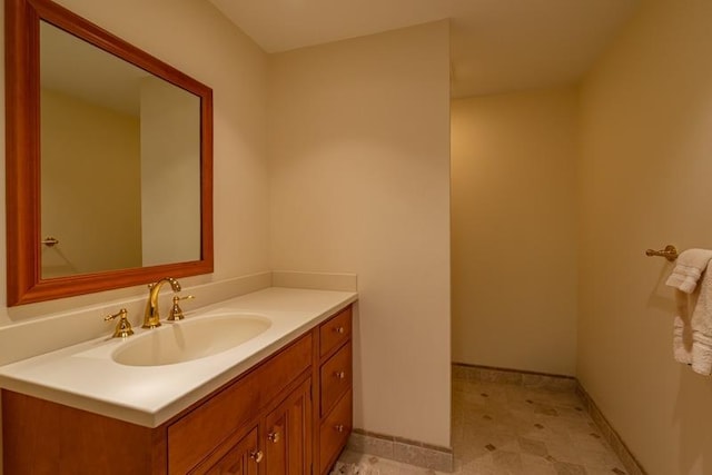 bathroom featuring vanity and baseboards